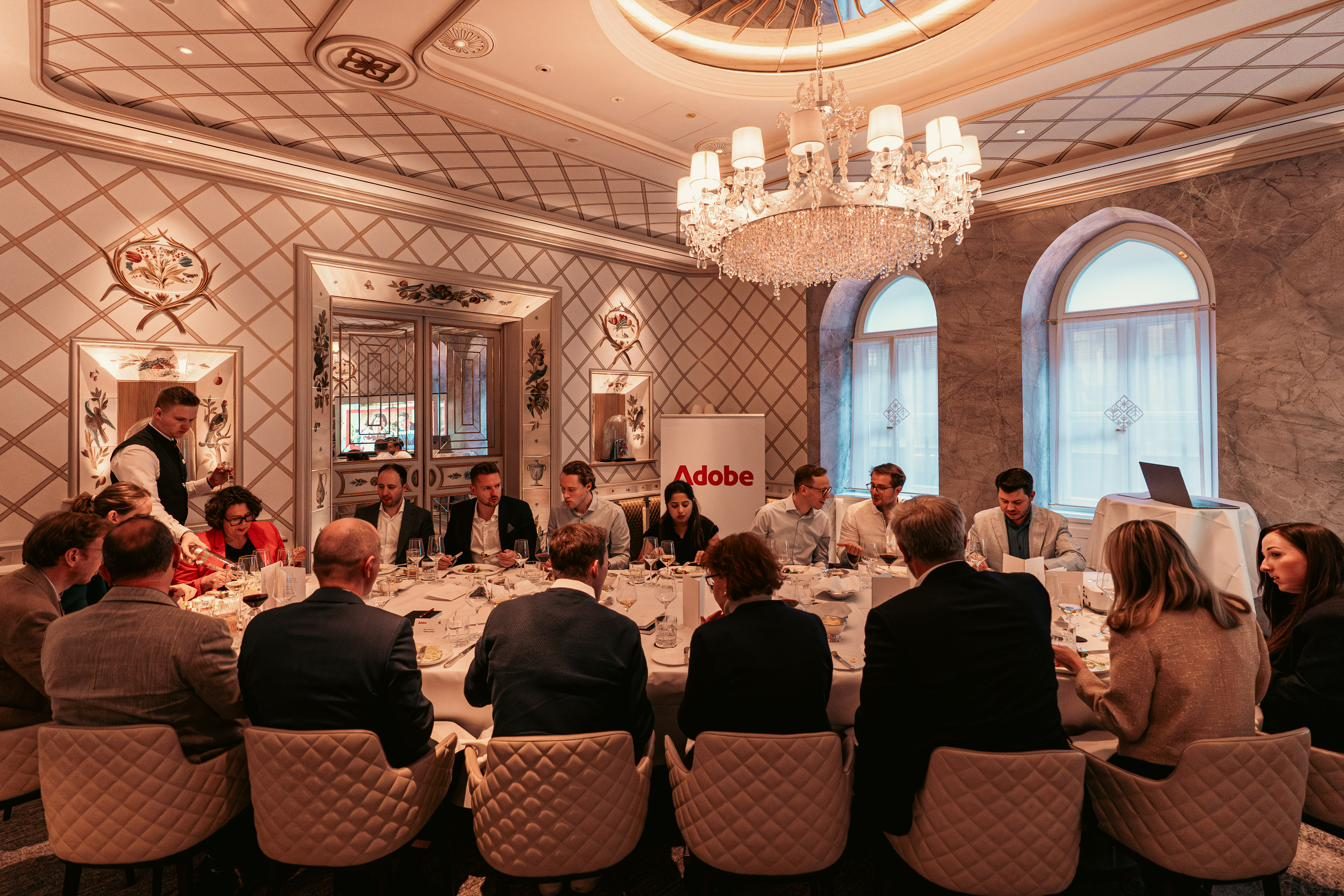Roundtable discussion under a chandelier